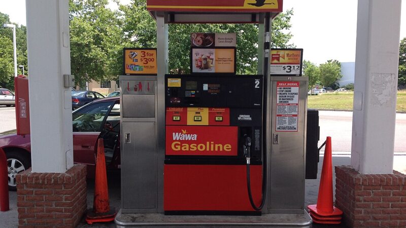 Modern petrol station pump showing unleaded, plus and premium fuel prices