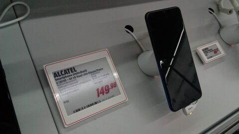 Smartphone with price tag on retail store display
