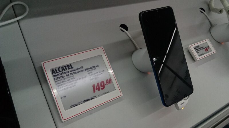 Smartphone with price tag on retail store display